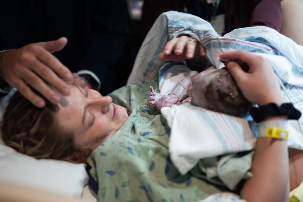A mother holding her newborn baby for the first time