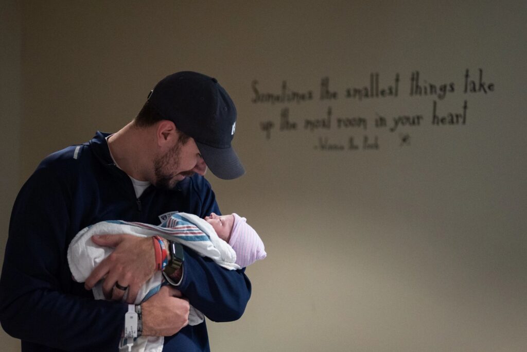 A father cradling his newborn baby for the first time in a Huntsville, Alabama hospital 