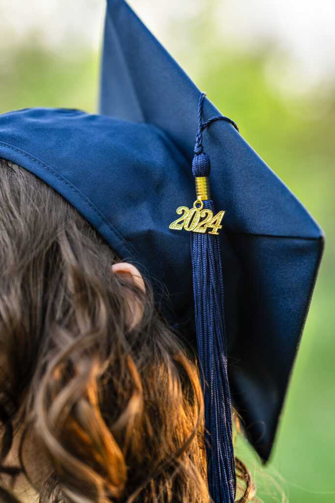 A close up image of Senior girl's 2024 tassel on her cap at Hayes Nature Preserve in Huntsville, Alabama