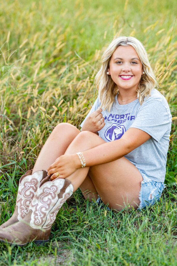 Senior girl in North Alabama University tee poses for picture